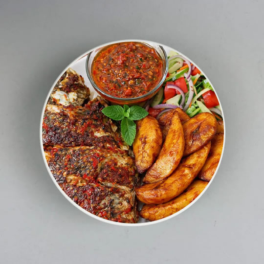 Grilled Tilapia or Catfish with Plantain, Yam or Chips, Pepper Sauce & Salad